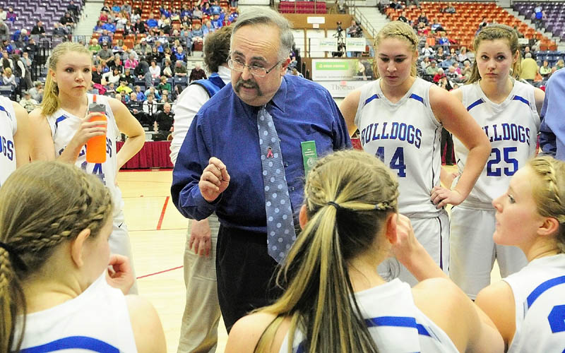 Madison coach Albert Veneziano talks to his team during a time out during a Western Maine Class C girls semifinal game against Old Orchard Beach on Thursday at the Augusta Civic Center.