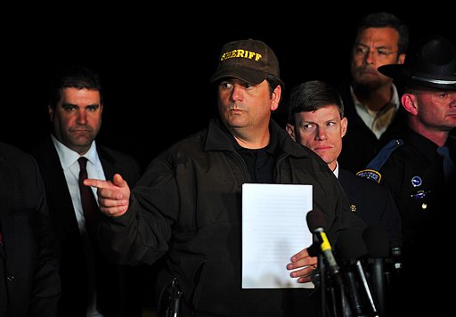 Dale County Sheriff Wally Olsen answers questions during a news conference late Monday in Midland City, Ala., where authorities stormed an underground bunker, freeing the 5-year-old boy and leaving his captor dead after a week of fruitless negotiations.