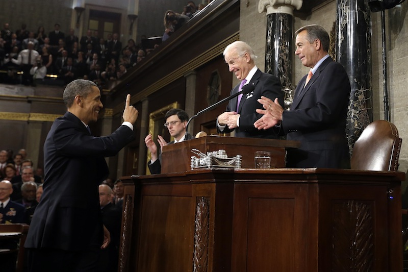 President Barack Obama gestures toward Vice President Joe Biden and House Speaker John Boehner of Ohio before giving his State of the Union address during a joint session of Congress on Capitol Hill in Washington, Tuesday Feb. 12, 2013. (AP Photo/Charles Dharapak, Pool) US Capitol