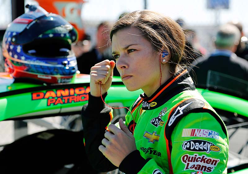 Danica Patrick removes her earplugs after qualifying for the Daytona 500 race Sunday.