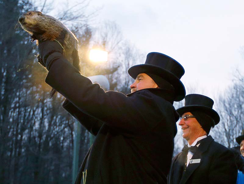 Groundhog Club Co-handler John Griffiths holds Punxsutawney Phil on Saturday. The club said Phil did not see his shadow and there will be an early spring.