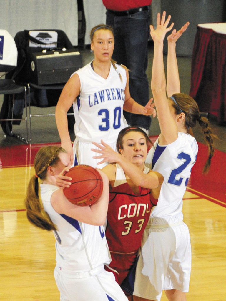 Cony senior guard Josie Lee gets double teamed by Lawrence’s Jordyn Towers, left, and Paige Belanger during Cony's 49-37 win in an Eastern Class A semifinal Wednesday at the Augusta Civic Center.