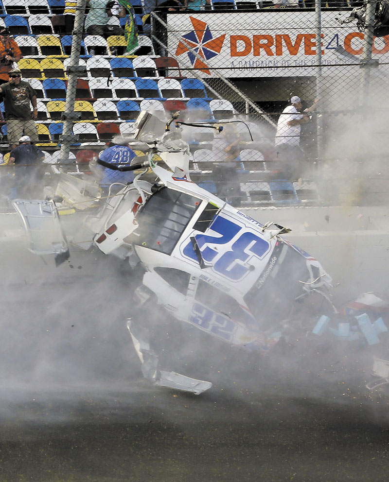 BIG CRASH: Kyle Larson crashes into the catch fence in a multi-car crash on the final lap of the NASCAR Nationwide Series on Saturday at Daytona International Speedway, Saturday in Daytona Beach, Fla.