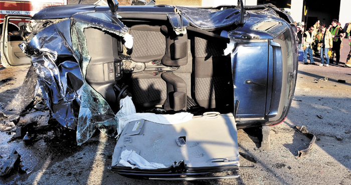 Nancy Hazard's car lies demolished and overturned on March 18, after it plowed into five vehicles parked at a traffic light in Waterville, sending six peole to the hospital.