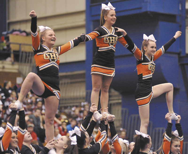 PUTTING ON A SHOW: Gardiner Area High School performs its routine during the Class B cheering state championships at the Bangor Auditorium on Monday.