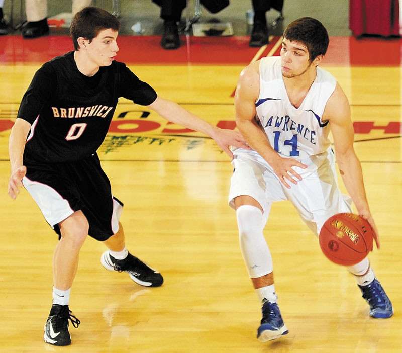 Brunswick's Blake Gordon, left, tries to stop Lawrence's Spencer Carey during an Eastern Class A tournament game on Saturday February 16, 2013 at the Augusta Civic Center.