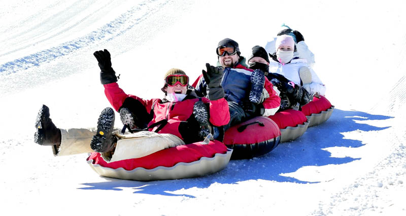 The Eaton Mountain Tubing and Skiing facility in Skowhegan was filled with people who spent the day sliding and having fun on Monday. This group came from North Country Harley Davidson shop in Augusta and are, from left, Mitch Van Horn, Derek Blondin, Scott Paul, Lauren Stetson and Aryn Weymouth.