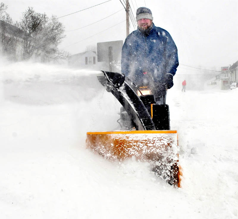 Luke Schaedle uses his snowblower as he tries to keep up with the snow storm that was near blizzard conditions at his home in Benton on Saturday.