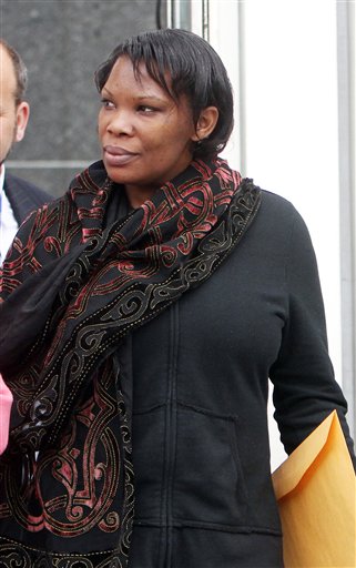 In this April 12, 2012 file photo, Beatrice Munyenyezi leaves the federal courthouse in Concord, N.H., after a mistrial in a case on whether she lied about her role in the 1994 Rwanda genocide to obtain U.S. citizenship. On Thursday Feb. 21, 2013 a jury convicted Munyenyezi of lying about Rwanda genocide to get U.S. citizenship. U.S. District Judge Steven McAuliffe stripped her of her citizenship and ordered her detained until her sentencing, scheduled for June 3. Her lawyers said they will appeal. (AP Photo/Jim Cole)