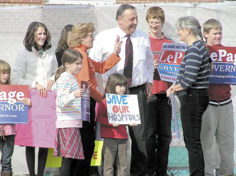 Paul LePage, then the Republican nominee for governor, talks to supporters in front of Central Maine Medical Center on Oct. 14, 2010, at a rally to decry the state’s debt to Maine’s hospitals. As governor, he has delivered on the debt payment that he promoted at the rally, named an industry lobbyist to a Cabinet post and called for another debt payment.