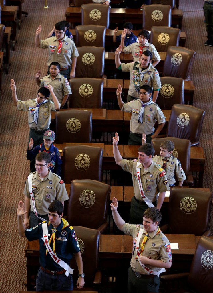 Boy Scouts recite their oath Saturday at the Texas capitol in Austin. The Boy Scouts organization emphatically reaffirmed its no-gays policy seven months ago, but said last week it was considering changing the stance.