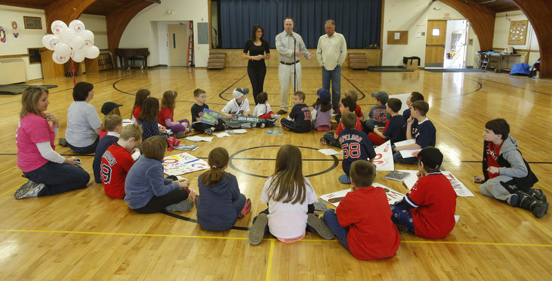 Jenny Dell, Don Orsillo and Jerry Remy, Red Sox announcers for the New England Sports Network, hold the attention of pupils at St. Brigid’s School in Portland during a New England road show that brought them to Portland Thursday.