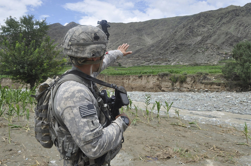 1st Lt. Doug Jones points across the Ghaki Valley road in Kunar province to where American and Afghan troops battled Taliban forces on June 27, 2010, when Staff Sgt. Eric Shaw of Exeter was killed on the road.