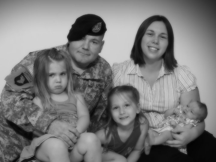 Staff Sgt. Eric Shaw poses for a family photo with his wife, Audrey, and their daughters, Victoria, Madison and Julia, just before he left for Afghanistan in June 2010.