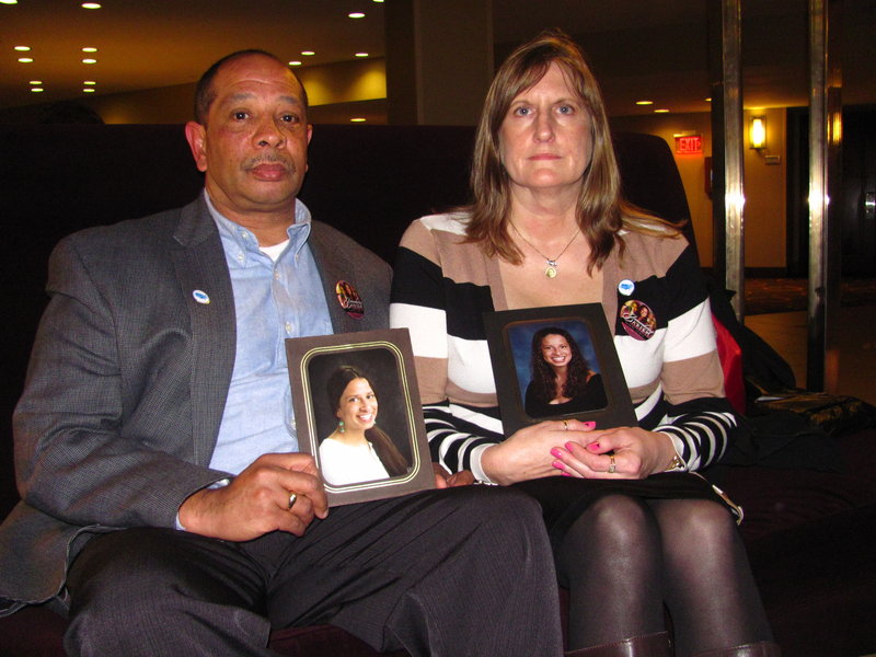 Wayne and Judi Richardson hold pictures of their daughter, Darien, who died in 2010 after being shot by an intruder at her Portland apartment. The Richardsons were in Washington, D.C., last week to lobby for gun law reform.