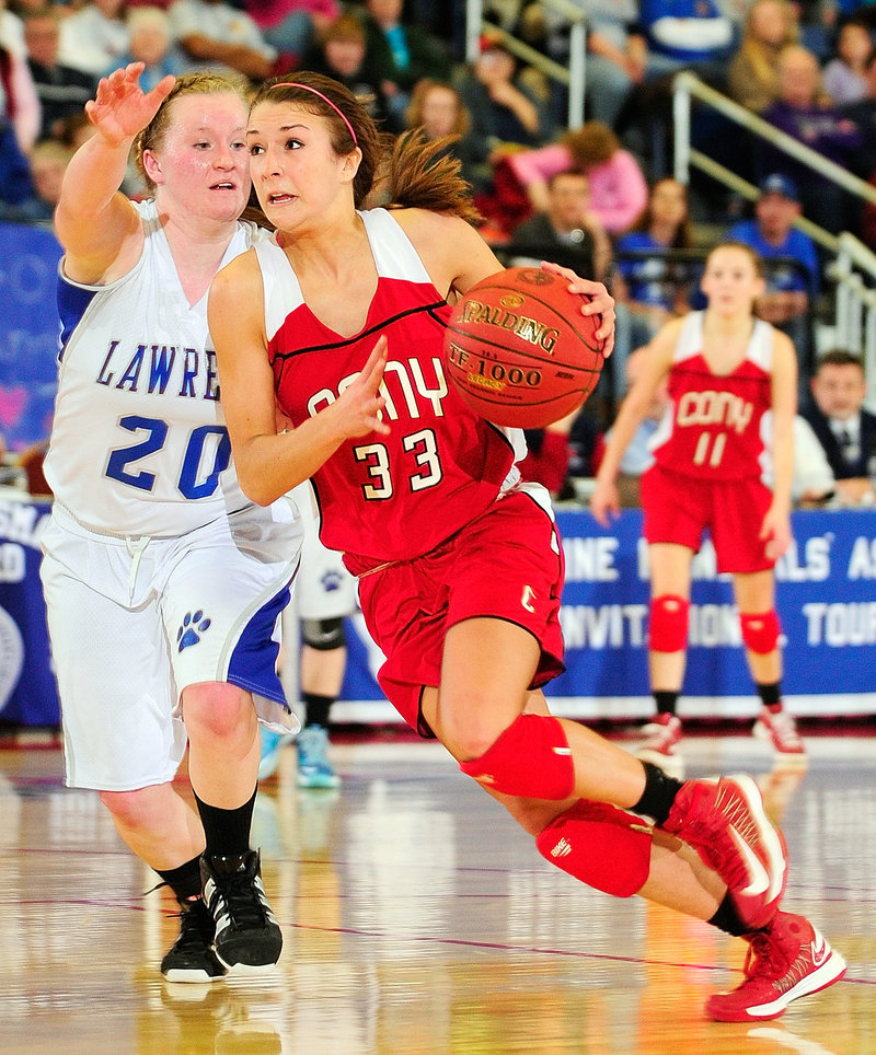 Josie Lee of Cony drives against Jordyn Towers during their Eastern Class A semifinal Wednesday at the Augusta Civic Center. Cony won 49-37.