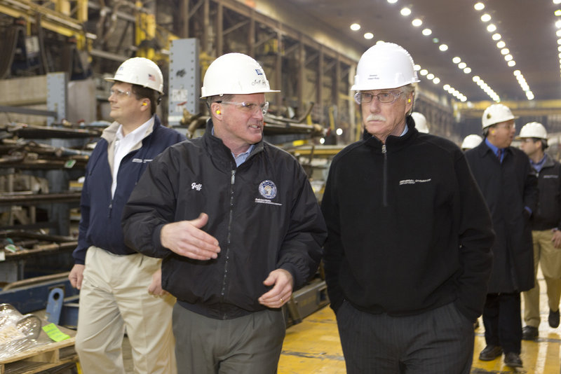 Bath Iron Works president Jeff Geiger talks with U.S. Sen. Angus King Thursday, Feb. 21, 2013, as King and Sen. Susan Collins toured the shipbuilding plant.