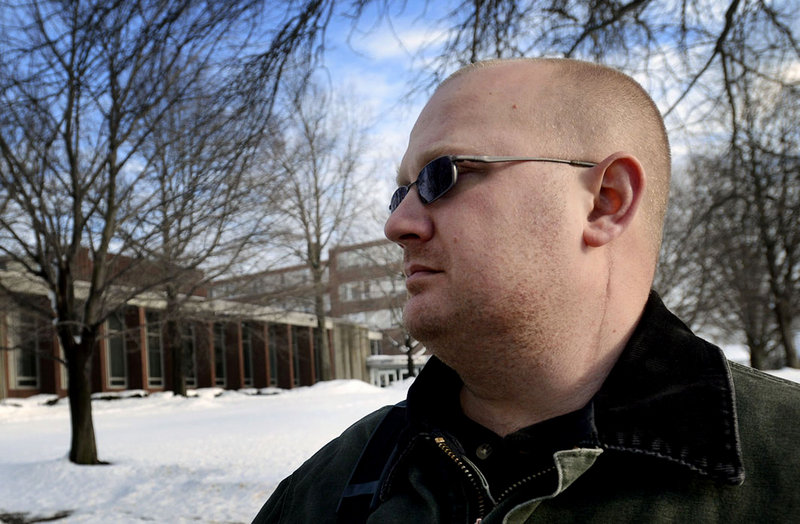 Veteran Chris Kotch on campus Monday at the University of Southern Maine in Portland, where he is taking classes. Scars can be seen along his neck from injuries sustained while serving in Iraq while in the Army Reserves.