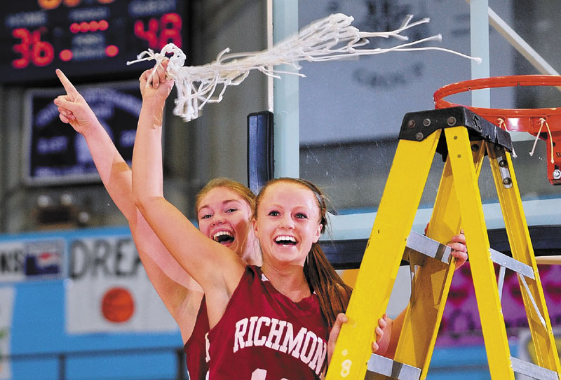 Richmond captains Brianna Snedeker, left, and Noell Acord celebrate after their team won its third straight Western Class D girls' basketball championship, beating top-seeded Rangeley 48-36 at the Augusta Civic Center.