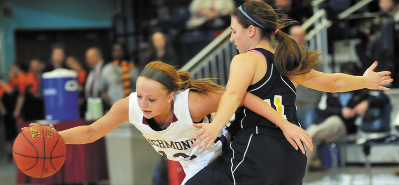 Richmond's Noell Acord, left, collides with Hyde's Shannon Ward in a Western Class D semifinal Thursday at the Augusta Civic Center. Richmond advanced to the regional final with a 43-36 victory.