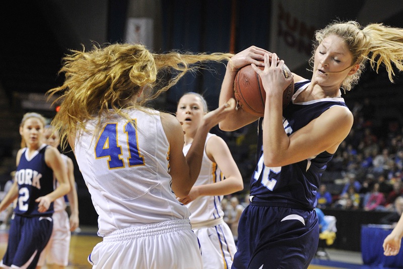 York's Emily Campbell wrestles the ball away from Lake Region's Kelsey Winslow during the Western Class B final Saturday. Lake Region won, 50-24. The Lakers will face Eastern champion Presque Isle for the state championship on Friday.