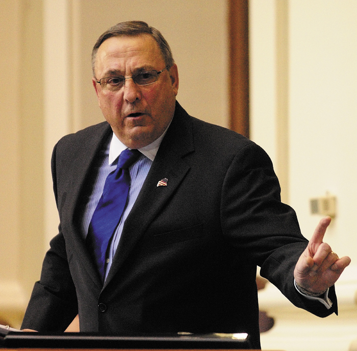 Staff photo by Joe Phelan Gov. Paul LePage gestures while giving the State of the State address on Tuesday February 5, 2013 in the State House in Augusta.