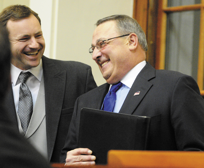 Gov. Paul LePage, right, chats with Maine Speaker of the House Mark Eves, left, before the governor gives the State of the State address on Tuesday February 5, 2013 in the State House in Augusta. A conservative think tank says Gov. Paul LePage’s two-year budget contains a “subtle tax increase," despite LePage's pledge to not raise taxes.