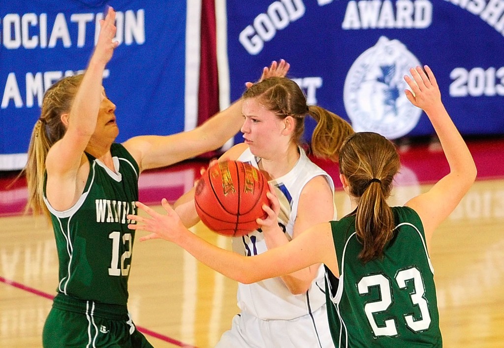 Madison junior guard Kirstin Wood, middle, is double teamed by Waynflete defenders Martha Veroneau, left, and Leigh Fernandez during the Western Maine Class C girls championship game on Saturday at the Augusta Civic Center.