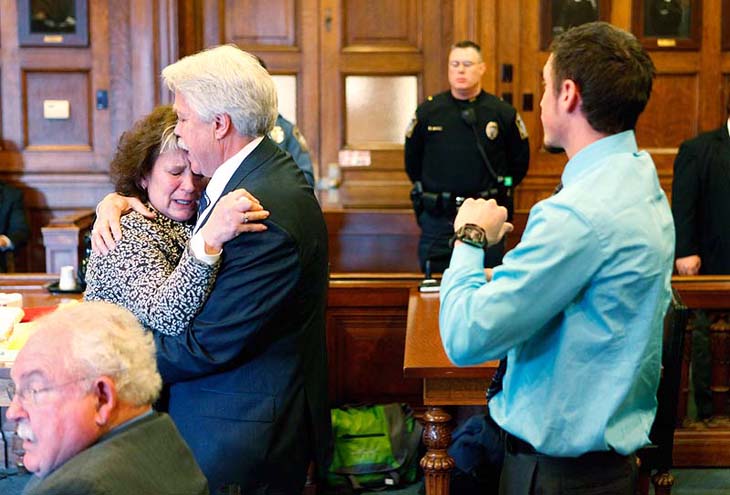 Mark Strong Sr. comforts his wife Julie after she became emotional while addressing Justice Nancy Mills during Strong's sentencing at Cumberland County Superior Court in Portland on Thursday.