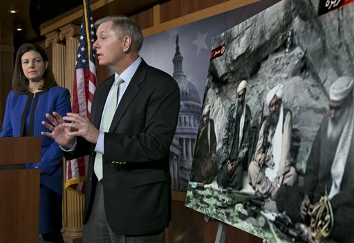 Sen. Lindsey Graham, R-S.C., accompanied by Sen. Kelly Ayotte, R-N.H., speaks to reporters on Capitol Hill In Washington, Thursday, March 7, 2013, about the capture of Osama Bin Laden's son-in-law Sulaiman Abu Ghaith. Sulaiman Abu Ghaith , Osama bin Laden's spokesman and son-in-law has been captured by U.S. intelligence officials, officials said Thursday, in what a senior congressman called a "very significant victory" in the ongoing fight against al-Qaida. (AP Photo/J. Scott Applewhite)