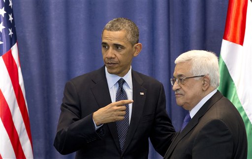 U.S. President Barack Obama, left, and Palestinian President Mahmoud Abbas leave after a joint news conference at the Muqata Presidential Compound, in the West Bank town of Ramallah, on Thursday.