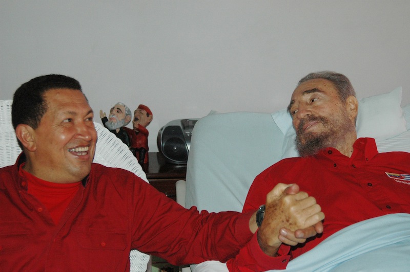 In this Aug. 13, 2006 file photo released by Cuba's Communist daily newspaper Granma, Cuba's leader Fidel Castro, right, and Venezuela's President Hugo Chavez hold hands as Castro recuperates from surgery in Havana, Cuba. Venezuela's Vice President Nicolas Maduro announced on Tuesday, March 5, 2013 that Chavez has died at age 58 after a nearly two-year bout with cancer. (AP Photo/Granma, File)