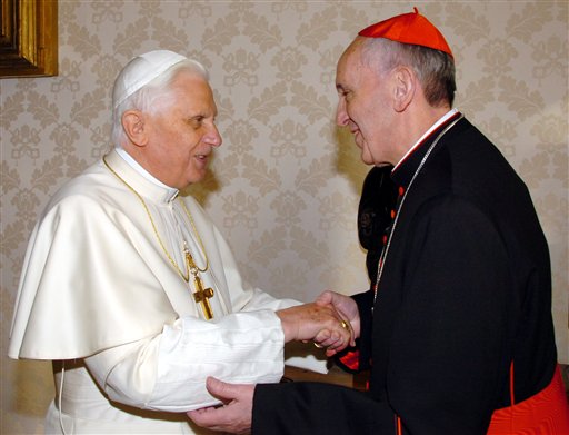 In this Jan. 13, 2007 file picture, Pope Benedict XVI shakes hands with the then-archbishop of Buenos Aires, Cardinal Jorge Bergoglio, during a meeting at the Vatican.