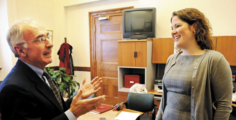 In this January 2011 file photo, then-House minority leader Emily Cain, D-Orono, speaks with Darryl Brown, former State Planning Office Director. Cain is considering running for Maine's 2nd District U.S. House seat if U.S. Rep. Mike Michaud joins the 2014 gubernatorial race.