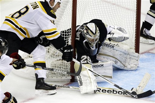 Boston Bruins right wing Nathan Horton (18) can't get the puck past Pittsburgh Penguins goalie Marc-Andre Fleury (29) in the third period of an NHL hockey game in Pittsburgh Tuesday, March 12, 2013. The Penguins won 3-2. (AP Photo/Gene J. Puskar)