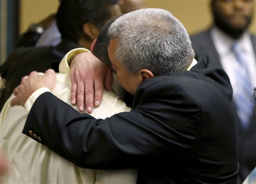 Trent Mays, 17, left, gets a hug from his father, Brian Mays, after Trent and co-defendant Ma'Lik Richmond, 16, were found delinquent on rape and other charges after their trial in juvenile court in Steubenville, Ohio, on Sunday. Mays and Richmond were accused of raping a 16-year-old West Virginia girl in August 2012.