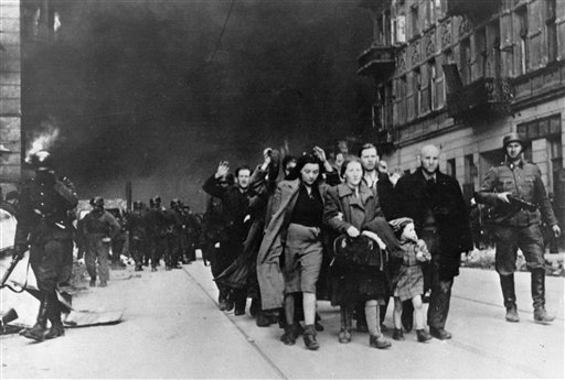 In this in April/May 1943 file photo, a group of Polish Jews are led away for deportation by German SS soldiers during the destruction of the Warsaw ghetto by German troops after an uprising in the Jewish quarter. U.S. gun rights advocates pointing to the 1943 Warsaw ghetto uprising by about 700 armed Jews who were able to fend off a much larger force of German troops for days until retreating to tunnels or fleeing.