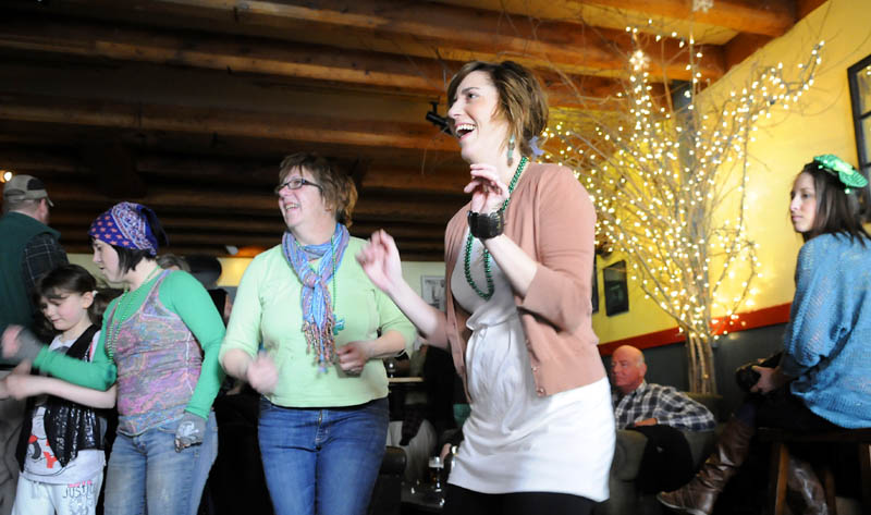 Folks dance to a band Sunday at Higher Grounds in Hallowell during St. Patrick's Day festivities.