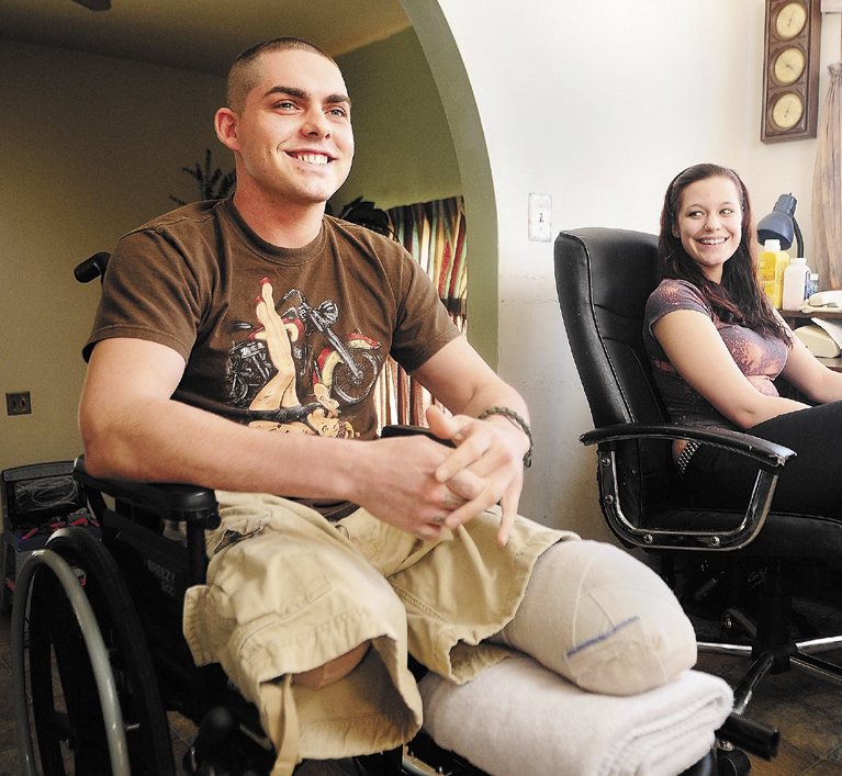 Jeremy Gilley, left, and his girlfriend, Rachael Turcotte, answer questions during an interview at his parent's home in Palermo.