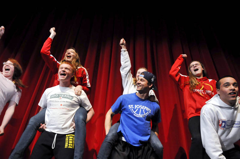 Cony High School students rehearse Wednesday for the 122nd Chizzle Wizzle at the Augusta school. Featuring a 1980s theme and titled "Rock of Stages," the annual performance by Cony students runs March 19-22. Tickets are available at the high school.