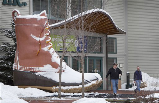 Shoppers walk past the iconic L.L. Bean boot outside the L.L. Bean retail store on Friday in Freeport.