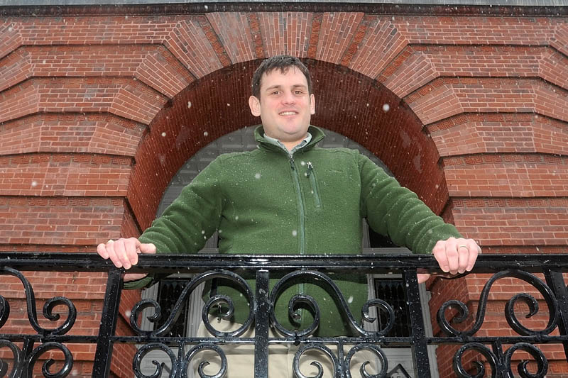 Alex Gaeth, chief executive officer of Big Brothers Big Sisters of Mid-Maine stands on the steps of the Waterville City Building at Castonguay Square in downtown Waterville Friday. The organization is expanding and coming back to work with at-risk kids in Somerset and Kennebec counties.