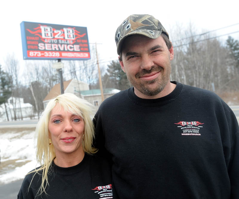 Shannon and Jason Hodgdon stand outsdie their B2B Car Service garage on Washington Street in Waterville in January. The Hodgdons changed the name of their business from Bumper to Bumper to B2B Auto Sales and Service, because of complaints against a company in Bangor named Bumper 2 Bumper.