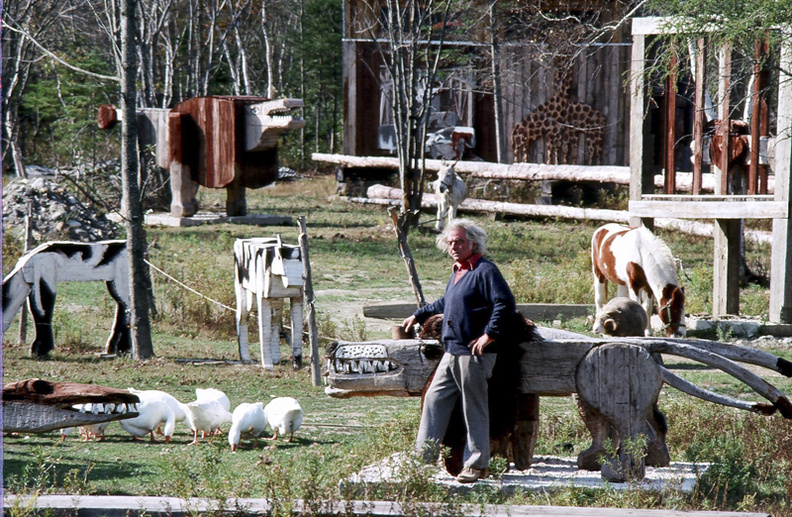 The late Maine artist Bernard Langlais at his Cushing estate, surrounded by some of his sculptures.