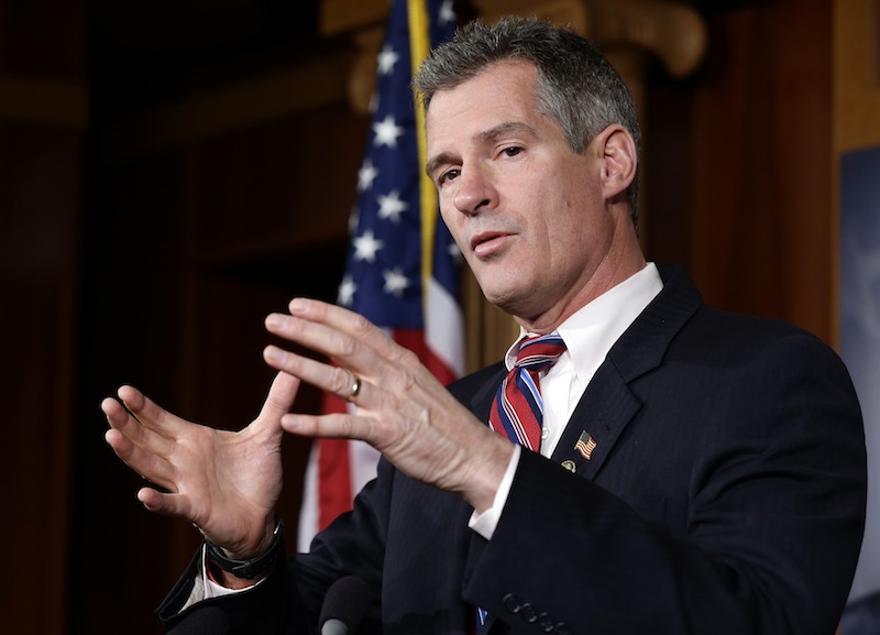 In this Nov. 13, 2012 file photo, then-U.S. Sen. Scott Brown, R-Mass., speaks during a media availability session. Brown announced Monday he had landed a new job with an international law firm but did not rule out a future run for political office in Massachusetts. (AP Photo/Alex Brandon)