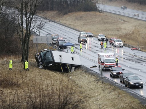 Law enforcement personnel work at the scene of a bus crash on the Adirondack Northway on Tuesday in Clifton Park, N.Y.