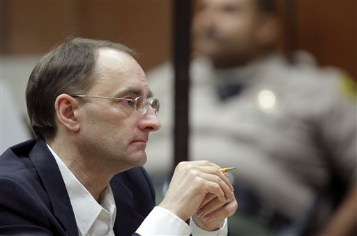 Christian Karl Gerhartsreiter listens during opening statements in his trial in Los Angeles Criminal Court on Monday. A prosecutor told jurors he will prove a cold-case murder allegation against the German immigrant who spent years moving through U.S. society under a series of aliases, most notoriously posing as a member of the fabled Rockefeller family.