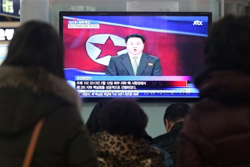 South Koreans watch a TV screen showing a North Korean state television news program on the country's nuclear test in this Feb. 12, 2013, photo.