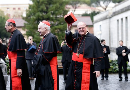 From left, U.S. Cardinals Roger Mahony, Edwin O'Brien and Timothy Dolan leave the North American College on Tuesday to go to the Vatican's Domus Sanctae Martae, the Vatican hotel where the cardinals stay during the conclave.