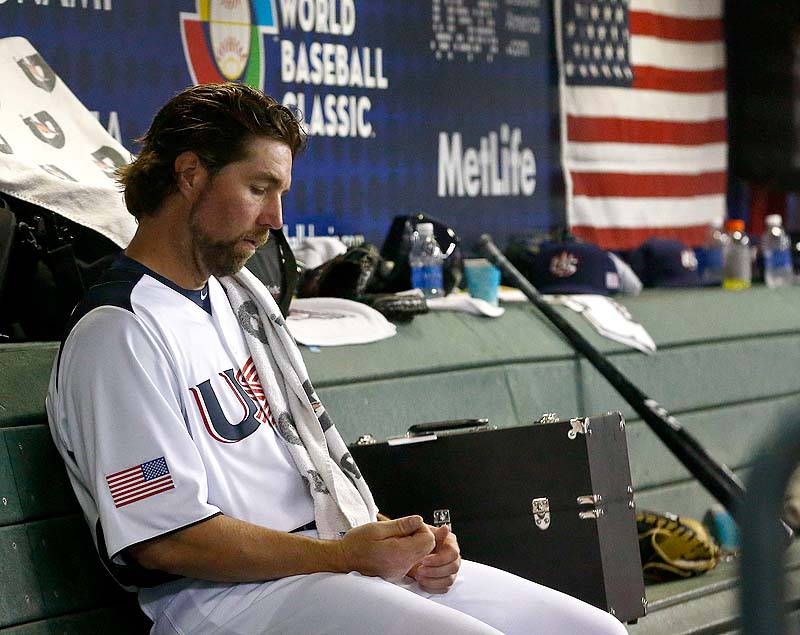 United States' R.A. Dickey sits in the dugout in the fourth inning during a World Baseball Classic baseball game against Mexico on Friday in Phoenix. Mexico defeated the United States 5-2.